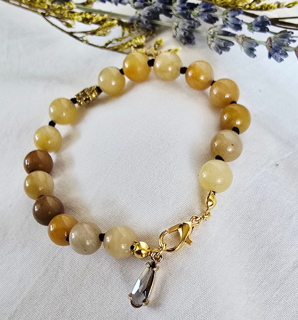 Hand-Knotted Yellow Jade Bracelet with Gold Lotus Bead
